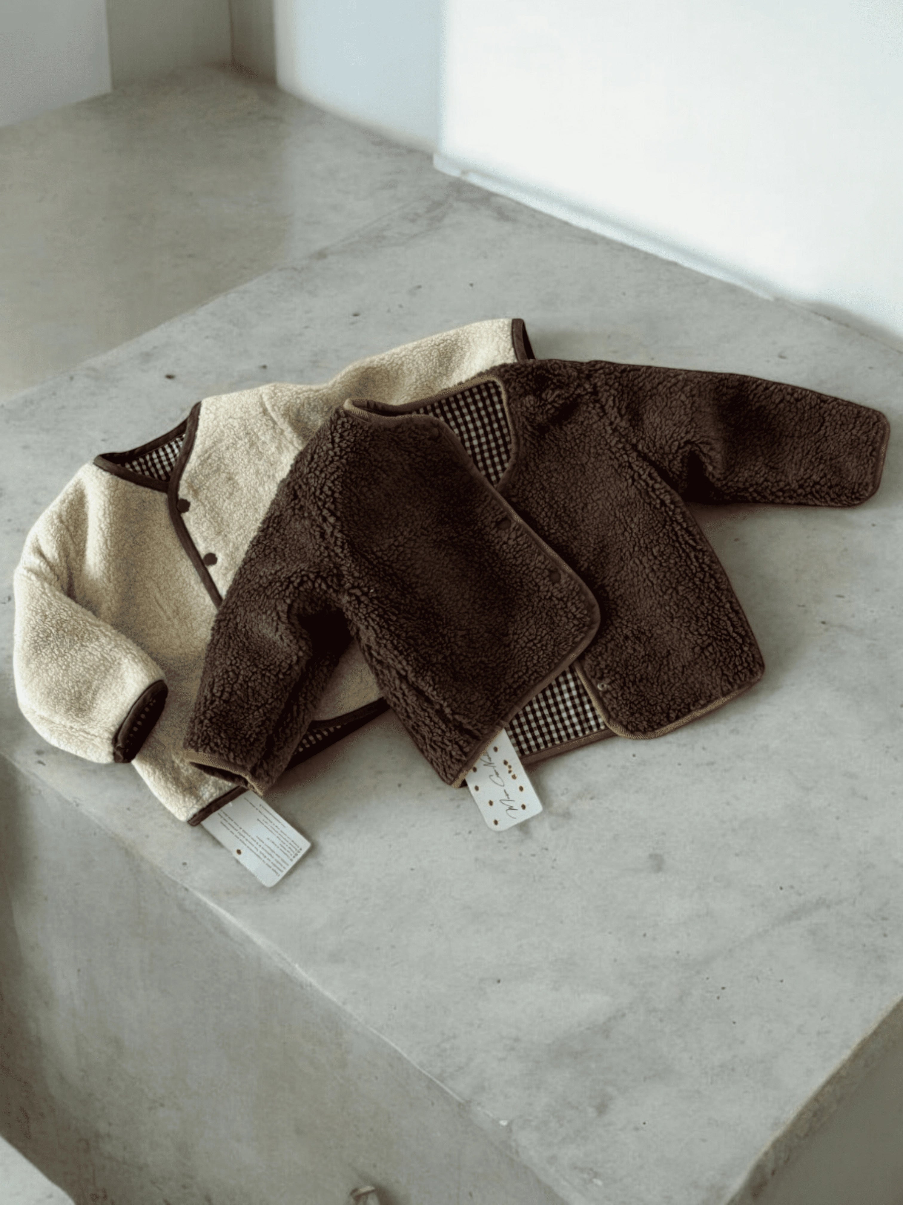 Confort Douillet Et Deux Looks en Un - Le Manteau Douillet Réversible Imitation Fourrure